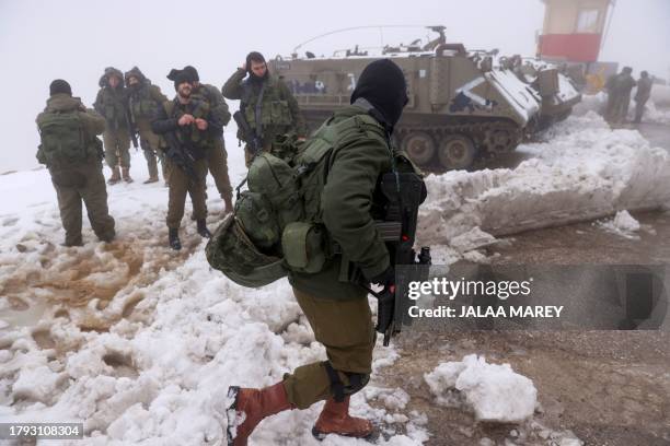 Israeli soldiers deploy on the top of the Mount Hermon near the border with Lebanon in the Israel-annexed Golan Heights on November 20 amid...