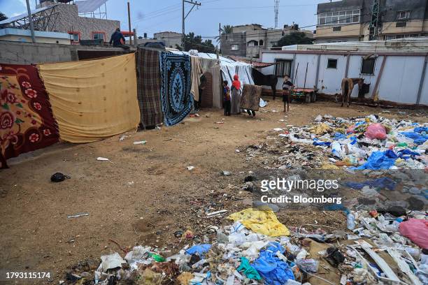 Discarded rubbish near temporary shelters in a camp for displaced Palestinians near the Shuhada Al-Aqsa hospital in Deir al-Balah, Gaza, on Monday,...