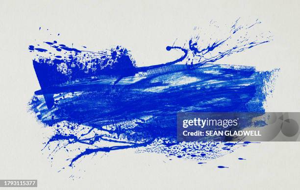 blue paint splash on canvas - paint stock pictures, royalty-free photos & images