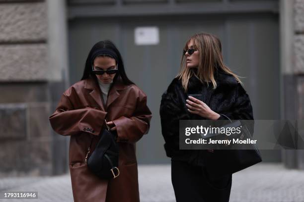 Anna Winter wears Celine black sunglasses, The Frankie Shop cream white high neck cropped knit sweater, Source Unknown brown oversized leather blazer...