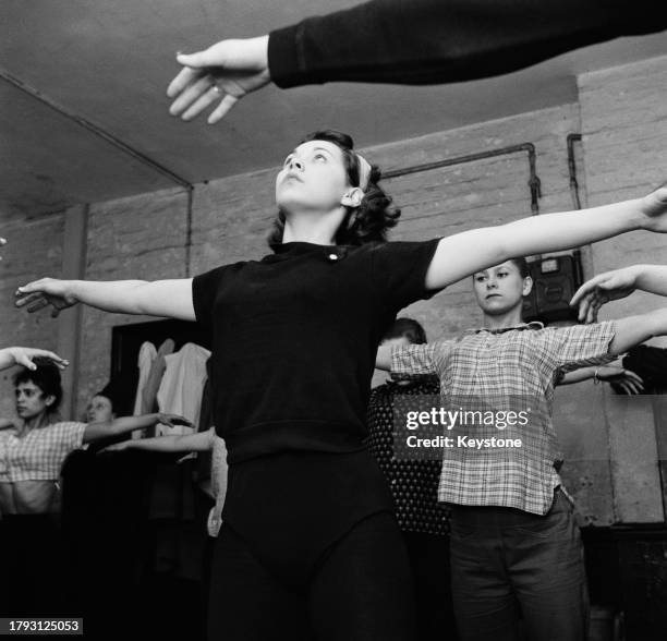 Dance students participating in breathing exercises during a 'method dance' class run by American dancer Eddie Roll in Soho, London, May 1959. The...