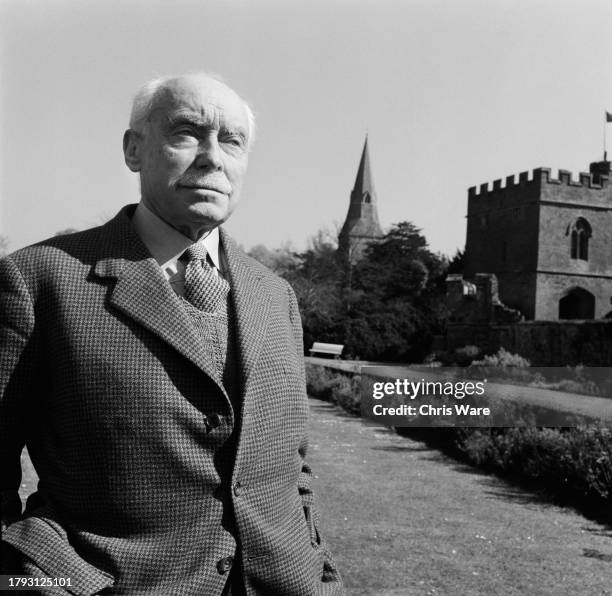 Ivo Murray Twisleton-Wykeham-Fiennes, 20th Baron Saye and Sele , walking in the grounds of Broughton Castle in Banbury, Oxfordshire, April 1959.