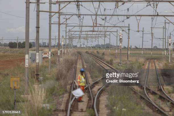 Worker prepares to signal on the train tracks on the central corridor rail freight line, between Sentrarand depot and Pyramid South depot, in...