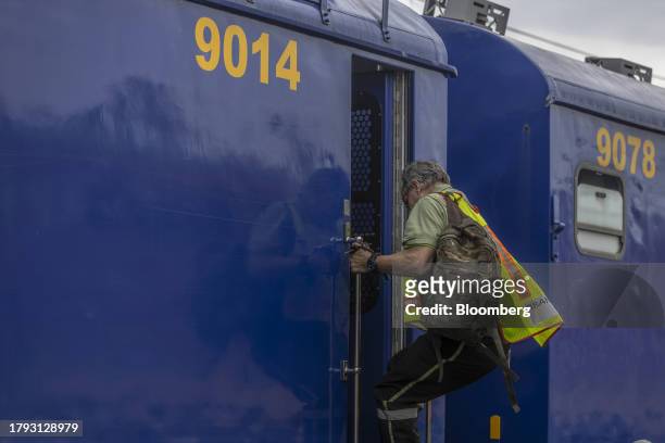 Driver boards a trolley train at the Transnet SOC Ltd. Sentrarand depot, in the Benoni district of Gauteng, South Africa, on Friday, Nov. 17, 2023....