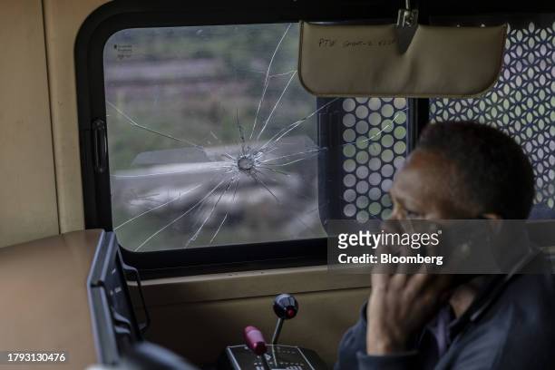 Smashed glass, caused by a the throwing of a projectile, in the drivers cabin of a freight locomotive on the central corridor rail freight line,...
