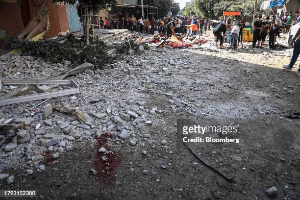 Image contains graphic content.) Blood on the ground following an Israeli military strike on a market in Deir al-Balah, Gaza, on Monday, Nov. 13,...