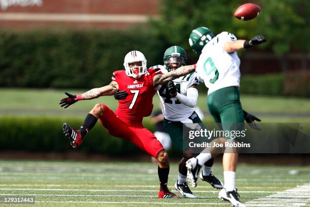 Damian Copeland of the Louisville Cardinals tries to make a reception on a pass defended by Josh Kristoff of the Ohio Bobcats during the game at Papa...