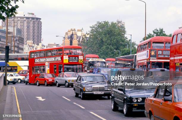 Cars, taxis, vans, coaches and buses queue in a traffic jam on Knightsbridge before entering the Hyde Park Corner road junction and gyratory in...