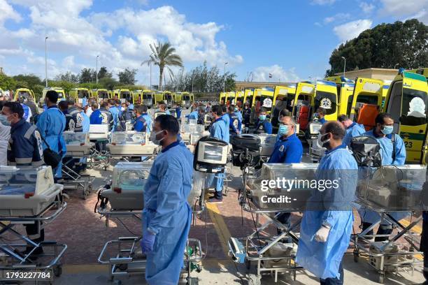 Egyptian medics stand by with incubators to receive premature Palestinian babies evacuated from Gaza on the Egyptian side of the Rafah border...