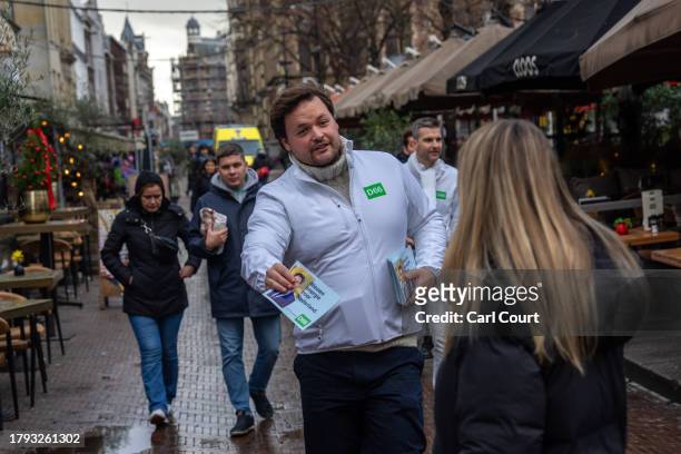 An activist hands out leaflets for the Democrats 66 party ahead of Wednesday's general election, on November 20, 2023 in The Hague, Netherlands. A...