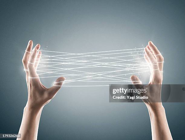 hand and cat's cradle - thread stock pictures, royalty-free photos & images