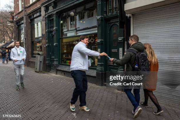 An activist hands out leaflets for the Democrats 66 party ahead of Wednesday's general election, on November 20, 2023 in The Hague, Netherlands. A...