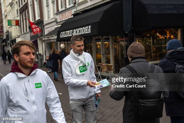 Activists hand out leaflets for the Democrats 66 party ahead of Wednesday's general election, on November 20, 2023 in The Hague, Netherlands. A snap...