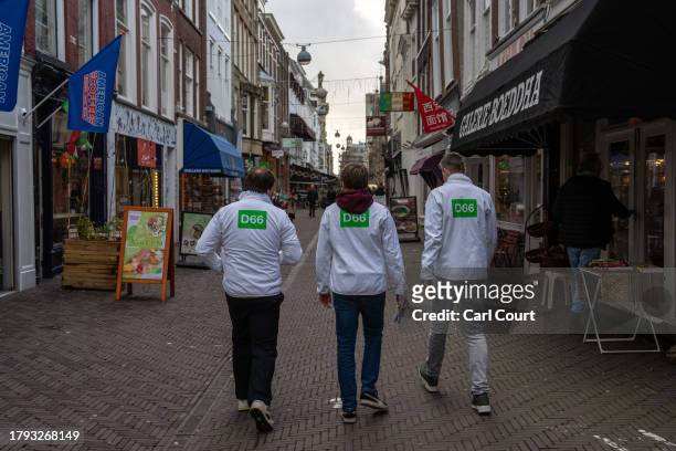 Activists hand out leaflets for the Democrats 66 party ahead of Wednesday's general election, on November 20, 2023 in The Hague, Netherlands. A snap...