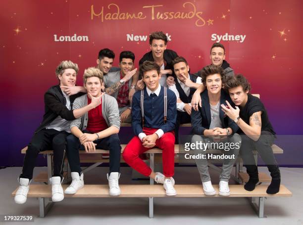 In this handout image provided by Madame Tussauds, Niall Horan, Zayn Malik, Louis Tomlinson, Liam Payne, and Harry Styles of One Direction pose...