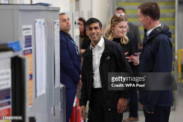 Britain's Prime Minister Rishi Sunak and Britain's Chancellor of the Exchequer Jeremy Hunt visit a college in north London on November 20, 2023 in...
