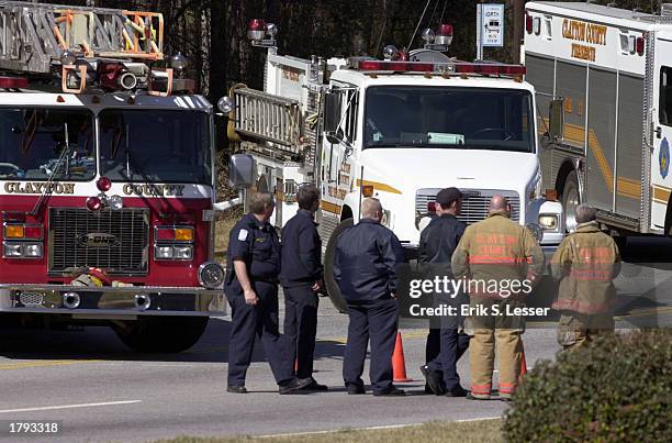 Members of the Clayton County Fire Department block access to Mt. Zion High School February 13, 2003 in Jonesboro, Georgia. The high school was...