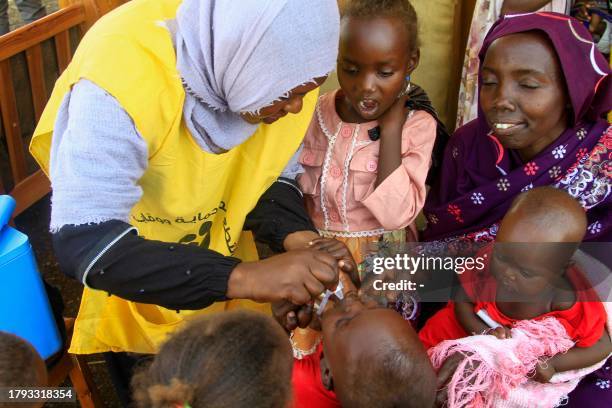 Nurse administers the cholera vaccine to a child in Sudan's Gedaref city on November 20 during a vaccination campaign to reduce the cholera epidemic...