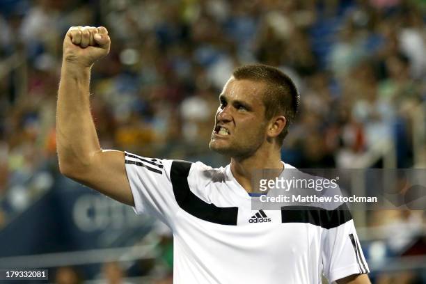 Mikhail Youzhny of Russia celebrates a point against Tommy Haas of Germany during their third round match on Day Seven of the 2013 US Open at USTA...