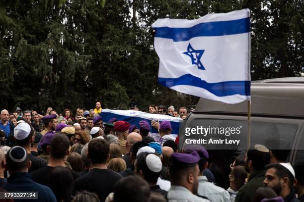 Soldiers carry the coffin of Lt. Adir Portugal during his funeral on November 20, 2023 in Mazkeret Batya, Israel. The Israeli military announced Lt....