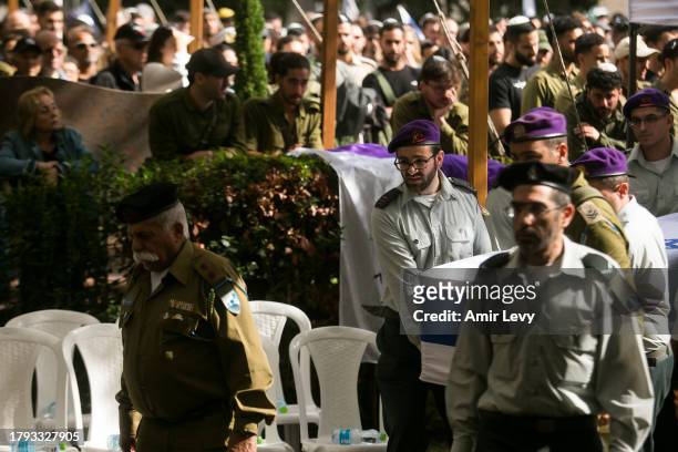 Soldiers carry the coffin of Lt. Adir Portugal during his funeral on November 20, 2023 in Mazkeret Batya, Israel. The Israeli military announced Lt....