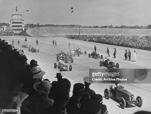 With the Nordkurve banking and control tower in the background, Charles "Charlie" Martin from Great Britain driving the English Racing Automobiles...