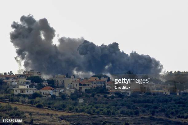 Smoke billows following an Israeli air strike on the outskirts of the Lebanese village of Alma al-Shaab on November 20 amid increasing cross-border...