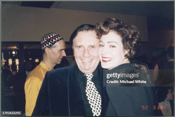Barry Humphries and Sean Young with Andrew Logan in the background, circa 1995.