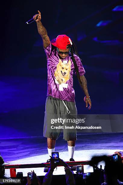 Rapper Lil Wayne performs during the 2013 America's Most Wanted Musical Festival at Verizon Wireless Amphitheatre on September 1, 2013 in Laguna...