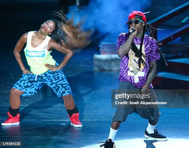 Rapper Lil Wayne performs during the 2013 America's Most Wanted Musical Festival at Verizon Wireless Amphitheatre on September 1, 2013 in Laguna...