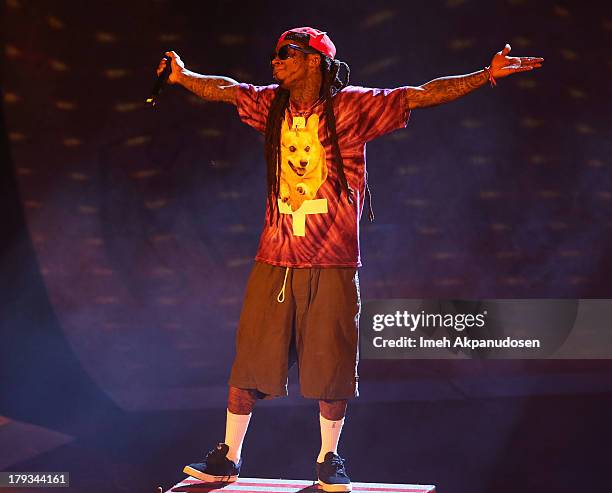 Rapper Lil Wayne performs during the 2013 America's Most Wanted Musical Festival at Verizon Wireless Amphitheatre on September 1, 2013 in Laguna...