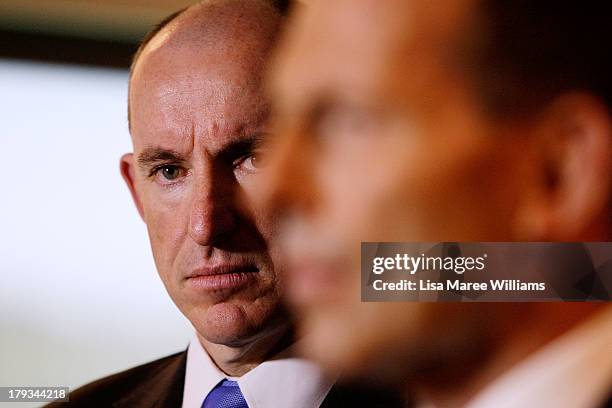 Australian Opposition Leader, Tony Abbott stands with Stuart Robert at Holsworthy Army Base on September 2, 2013 in Sydney, Australia. According to...