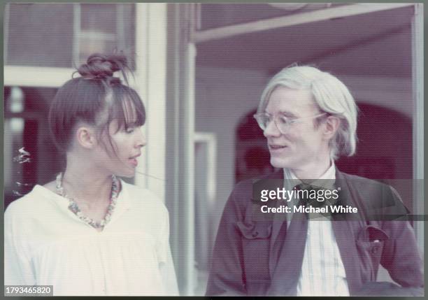 Andy Warhol talking with film director Lyndall Hobbs, circa 1980.