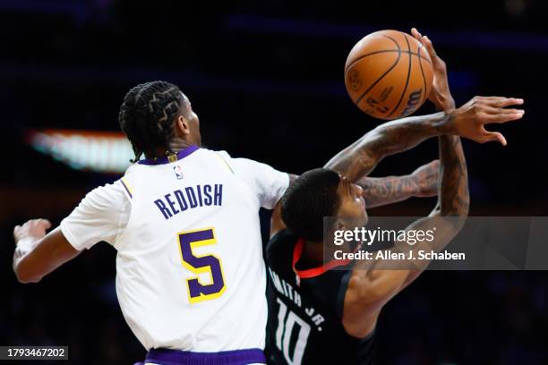Los Angeles Lakers forward Cam Reddish and Houston Rockets forward Jabari Smith Jr. Battle for the rebound during the second half at Crypto.com Arena...