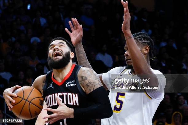 ULOS ANGELES, CA Houston Rockets guard Fred VanVleet drives to the basket against Los Angeles Lakers forward Cam Reddish during the first half at...