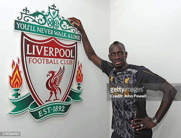 Mamadou Sakho poses for a photo after signing a contract for Liverpool Football Club at Melwood Training Ground on August 31, 2013 in Liverpool,...