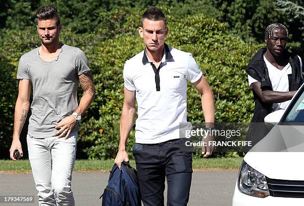 French forward Olivier Giroud, defender Laurent Koscileny and defender Bacary Sagna arrive at the French national football team training base in...