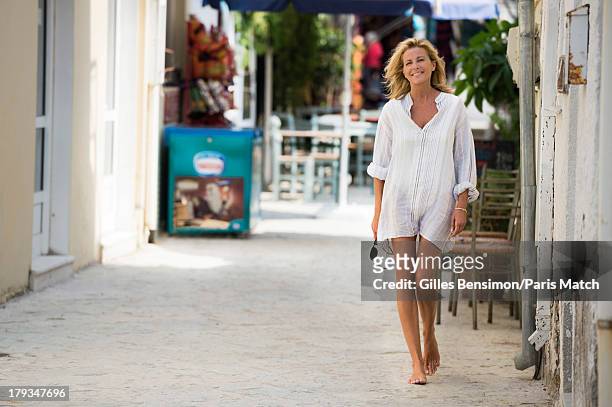 Tv presenter Claire Chazal is photographed on the Greek island of Paxos for Paris Match on August 16, 2013 in Greece.
