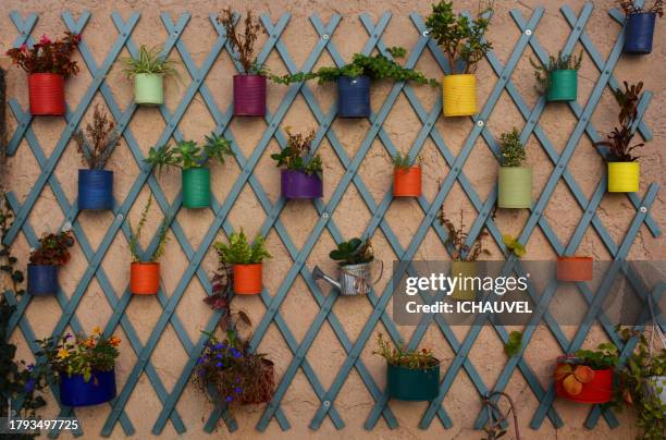 floral hanging decoration france - flower basket stock pictures, royalty-free photos & images