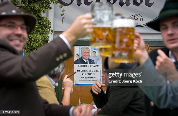 Supporters of Horst Seehofer, Chairman of the Bavarian Christian Democrats , propose a toast at the annual Gillamoos beer tent day of politics on...