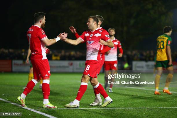 Nicky Cadden of Barnsley celebrates with teammate Herbie Kane after scoring the team's first goal during the Emirates FA Cup First Round Replay match...