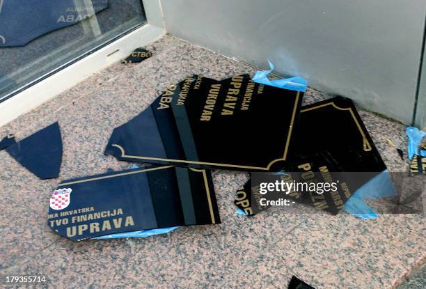 Sign in Serb Cyrillic script lies on the ground after being ripped off a wall by Croatian protestors on September 2, 2013 in Vukovar, a Croatian town...