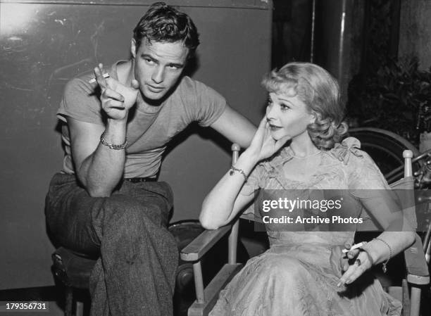 American actor Marlon Brando and British stage and film actress Vivien Leigh relax on the set of 'A Streetcar Named Desire', circa 1951.