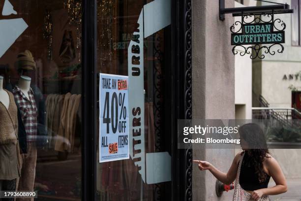 Sale sign at an Urban Outfitters store in Walnut Creek, California, US, on Friday, Nov. 17, 2023. Urban Outfitters Inc. Is expected to release...