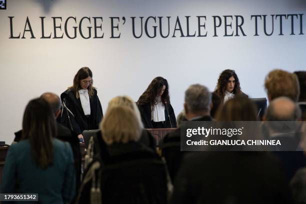 Magistrates stand during the reading of the verdict at the maxi mafia-trial in Lamezia Terme on November 20, 2023 where some 200 people were...