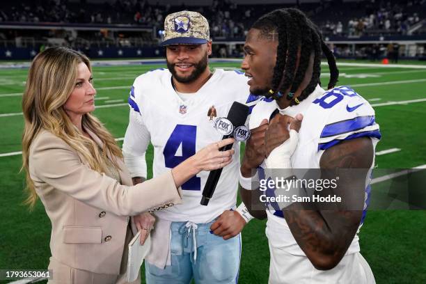 CeeDee Lamb and Dak Prescott of the Dallas Cowboys are interviewed by Erin Andrews after the game against the New York Giants at AT&T Stadium on...