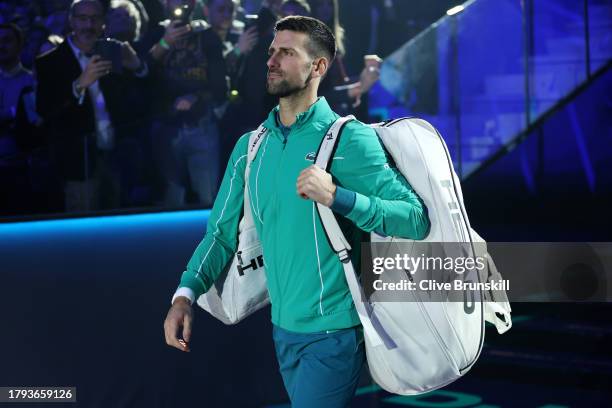 Novak Djokovic of Serbia walks out to the court for his match against Jannik Sinner of Italy in the Men's Singles Round Robin match on day three of...