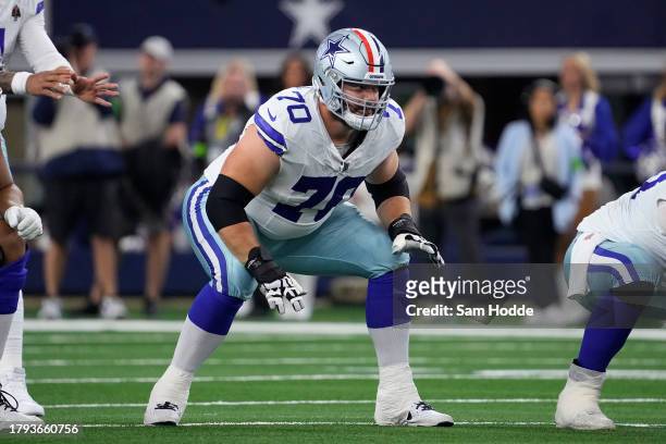 Zack Martin of the Dallas Cowboys waits at the line of scrimmage before a play during the first half of the game against the New York Giants at AT&T...