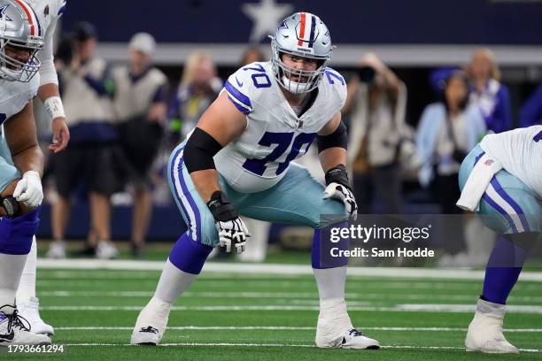 Zack Martin of the Dallas Cowboys waits at the line of scrimmage before a play during the first half of the game against the New York Giants at AT&T...