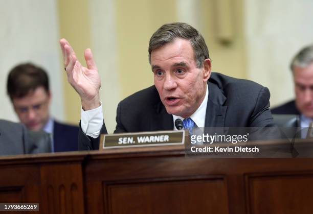 Sen. Mark Warner delivers remarks during a Rules Committee hearing at the Russell Senate Office Building on November 14, 2023 in Washington, DC. The...